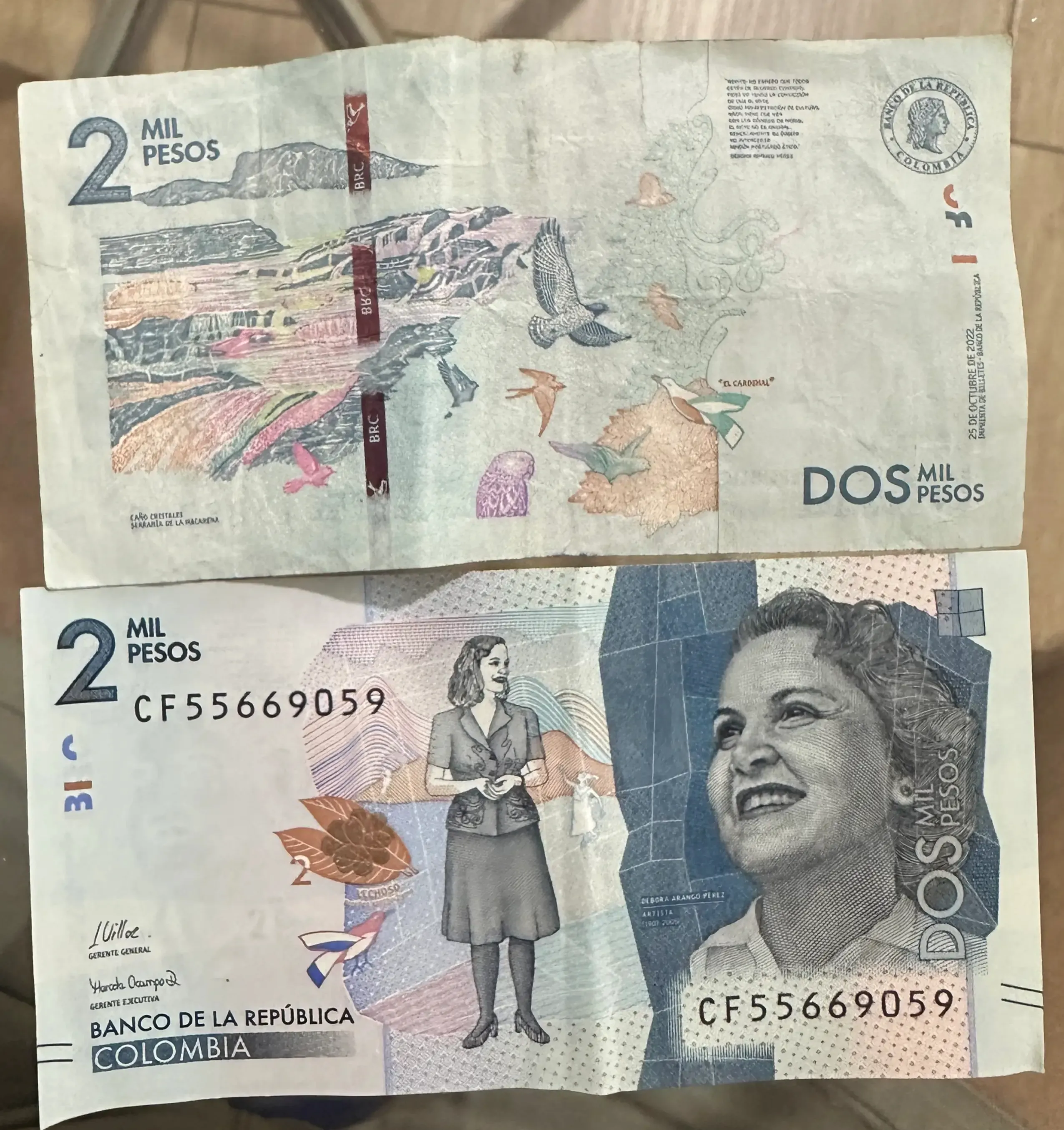 2,000 Colombian peso banknote, featuring vibrant blue tones and natural elements in its design